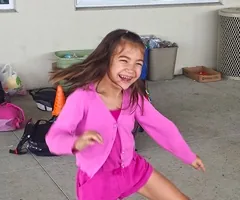 Smiling girl dancing