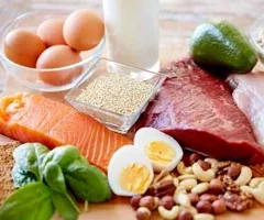Healthy foods: eggs, salmon, nuts, avocado and vegetables